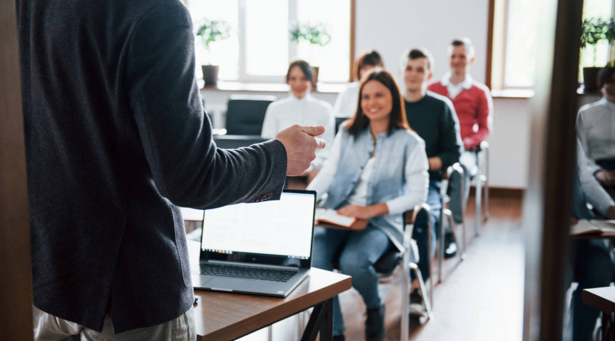 Image cheerful mood group of people at business conference in modern classroom at daytime